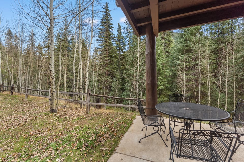 Step onto your private patio and breathe in the crisp mountain air while enjoying peaceful forest views from your outdoor dining space.