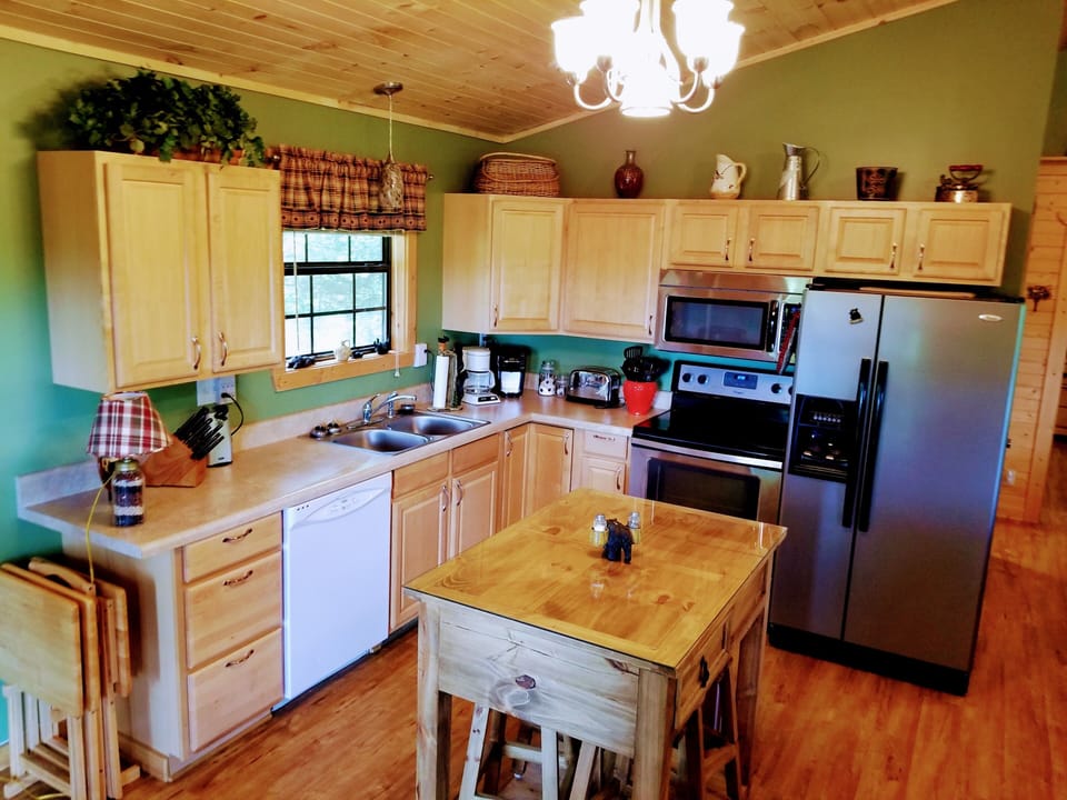 Fully stocked kitchen with seating for 4 at the bar and 4 at the table.