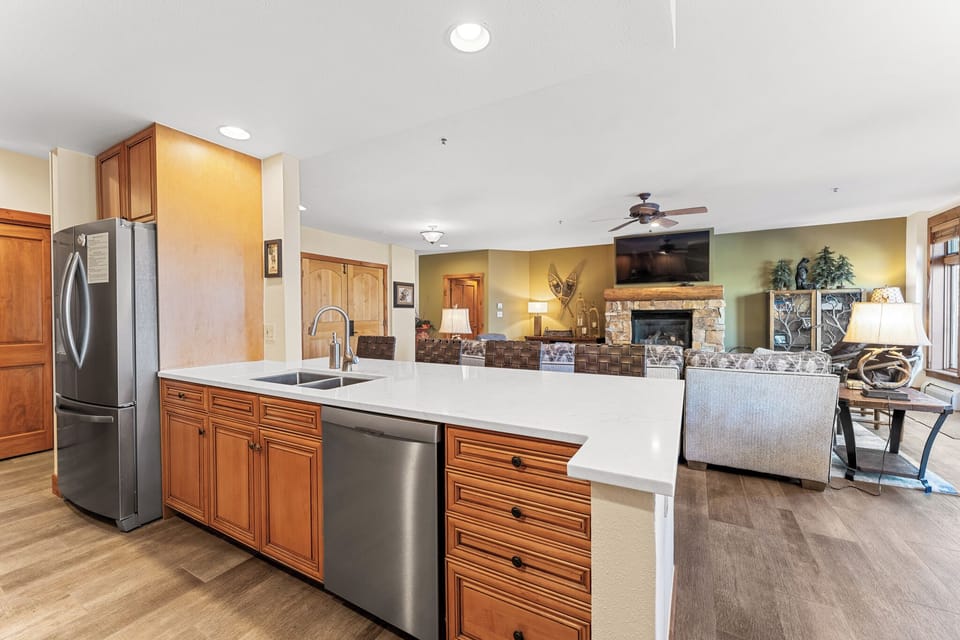 You'll love the spacious open-concept layout with modern kitchen featuring granite counters, stainless appliances, and cozy living area with stone fireplace.