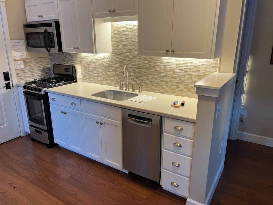 Complete kitchen with 4 burner stove, Microwave and Bosh dishwasher