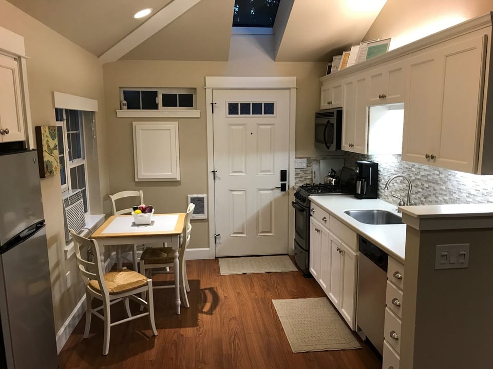 Four burner gas stove/oven, microwave, refrigerator, ice maker and Bosch DW