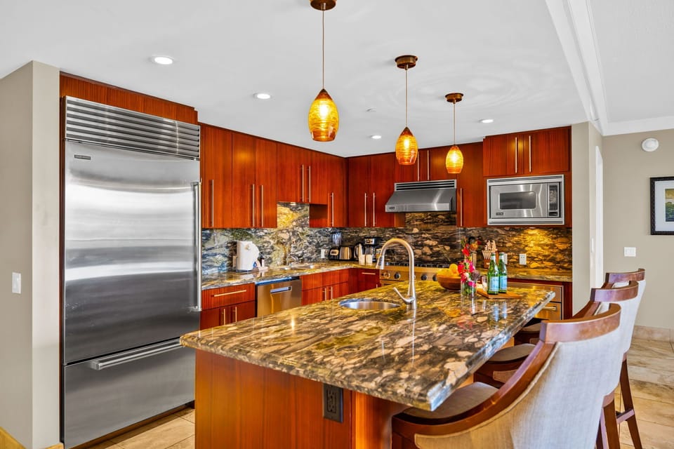 Open kitchen with seating at the island invites casual dining and conversation