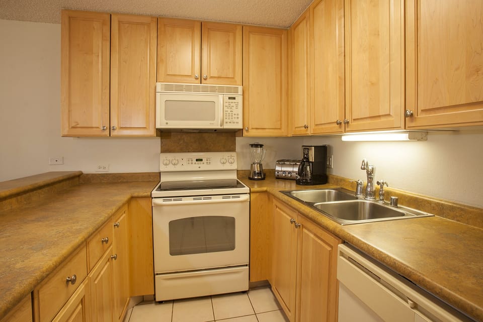 A fully equipped kitchen with ample counter space, modern appliances, and everything you need to prepare your favorite meals during your stay.