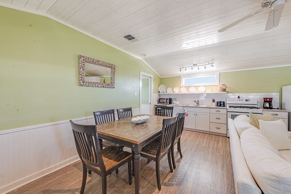 Your open-concept space combines a fully equipped kitchen with a cozy dining area, perfect for preparing and sharing meals together.