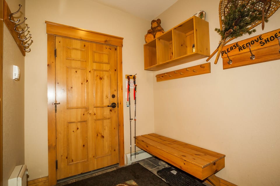 Step into your welcoming entryway with handcrafted wooden storage and rustic mountain charm that sets the perfect tone for your alpine getaway.