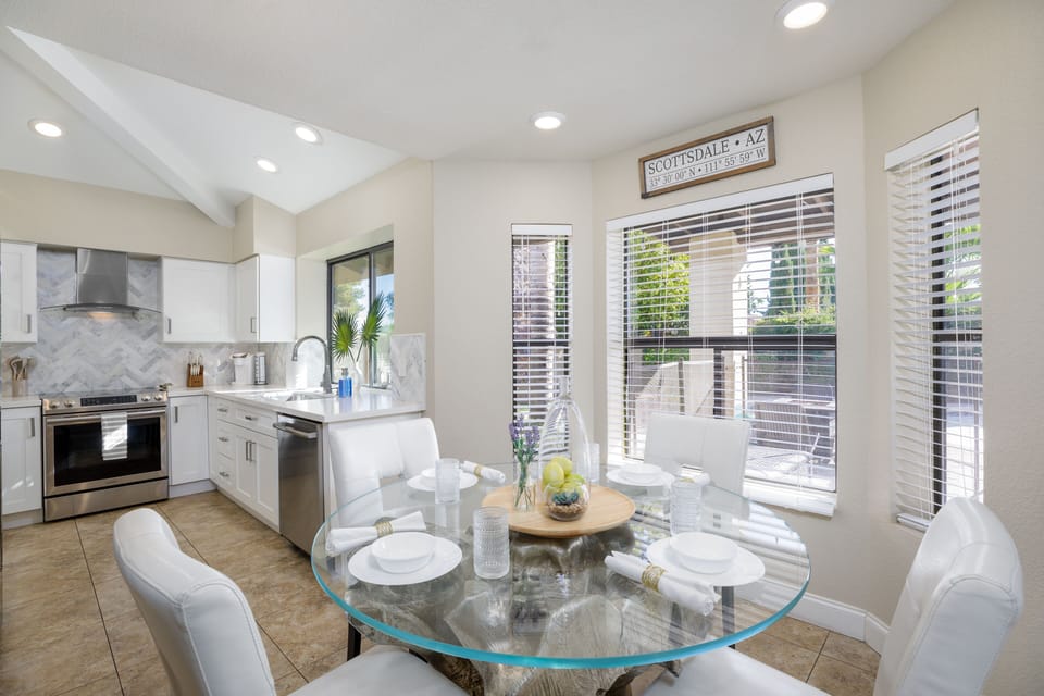 The kitchen eating area with views of the private backyard.