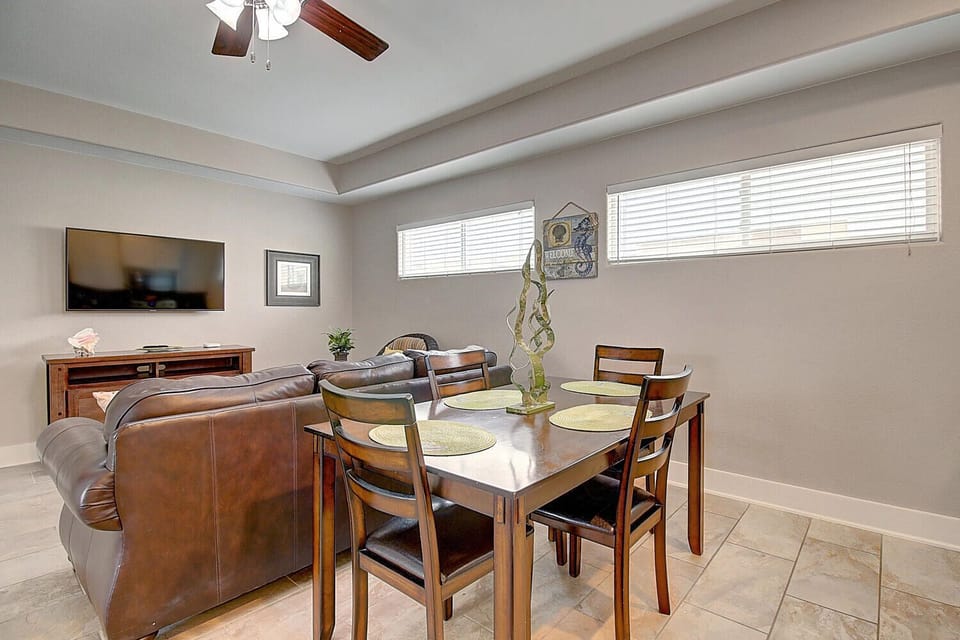 Gather around your elegant dining table with warm wood tones and comfortable seating for six, perfect for memorable meals together.