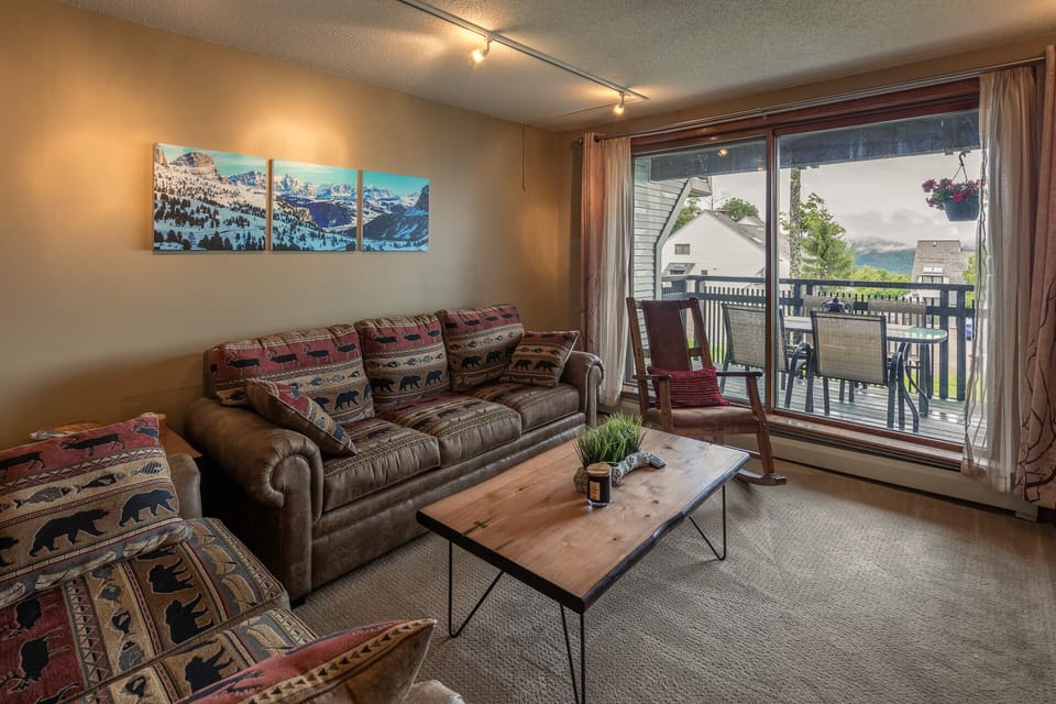 Relax in the living room after skiing/hiking. Couch converts to a queen size bed