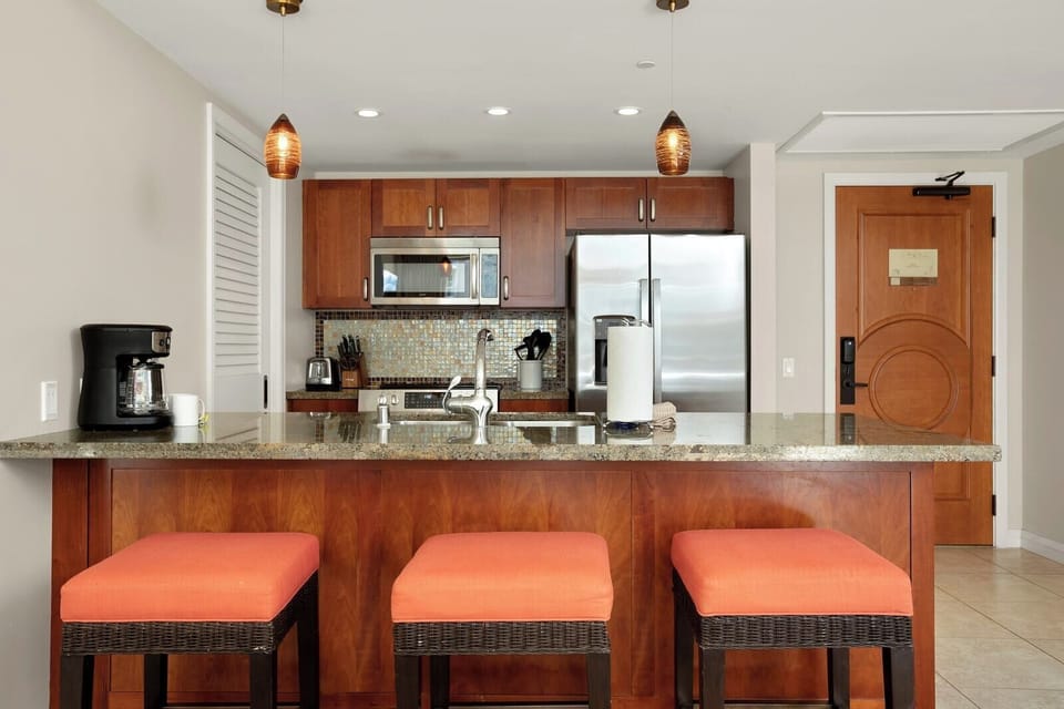 High-end finishes and ambient lighting create a warm, modern atmosphere
