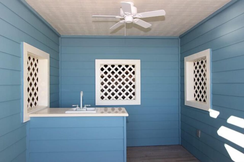 The beach level deck has a gas grill, sink, and fresh water shower