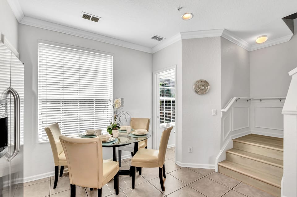 Intimate Dining Experience: Gather around this cozy dining table for four, perfect for enjoying meals with loved ones and creating lasting memories.