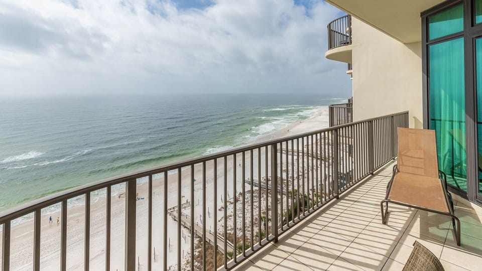 Relax on your balcony and bask in the sunlight with mesmerizing views of the gulf coast on your beach retreat