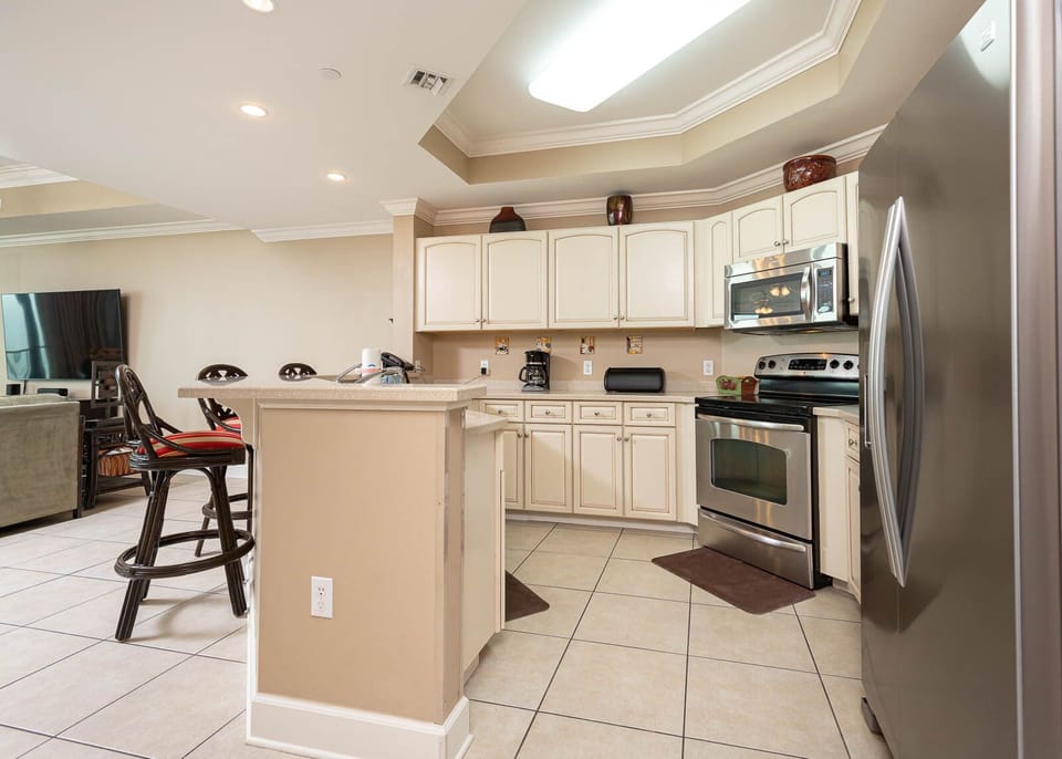 Whip up your favorite meals in this kitchen, feeling the coastal vibe while connecting with family in comfort