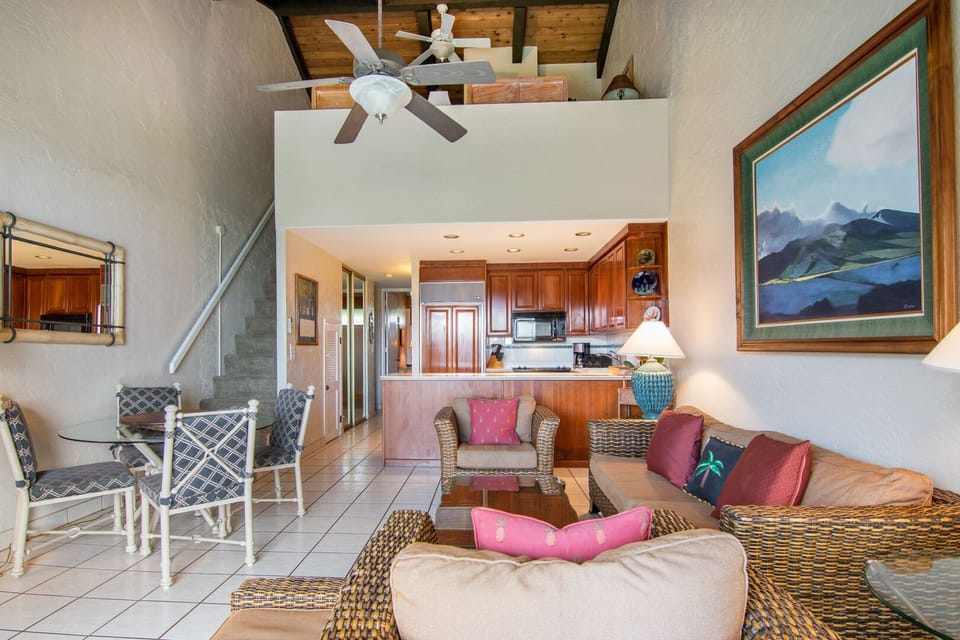 Loft bedroom overlooks living room area