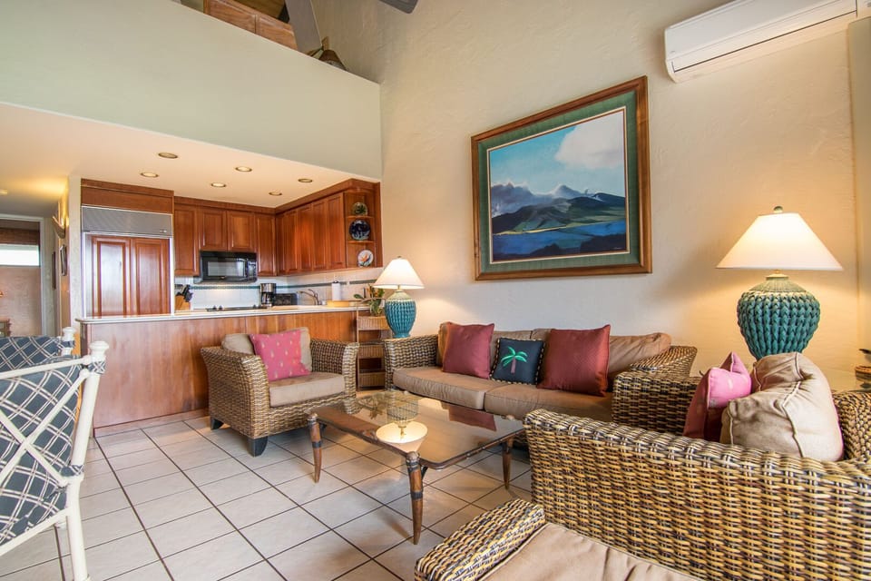 Living room area features Queen size sleeper sofa for additional guests