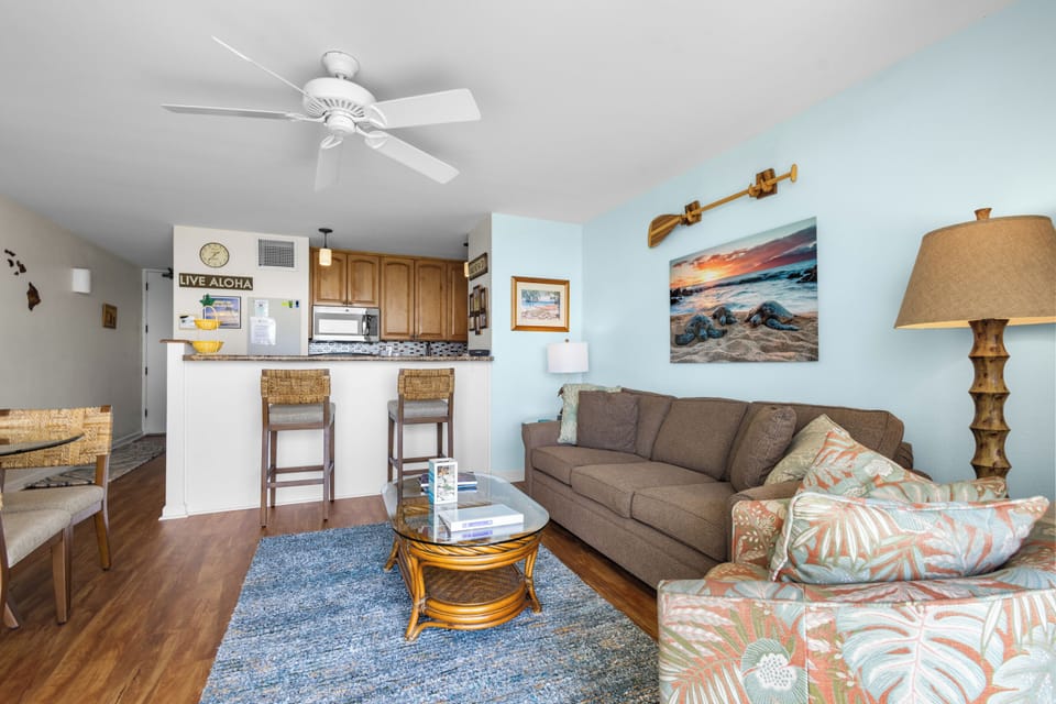 Unwind in your tropical-inspired living space with plush seating and beachy decor—perfect for relaxing after a day of island adventures.