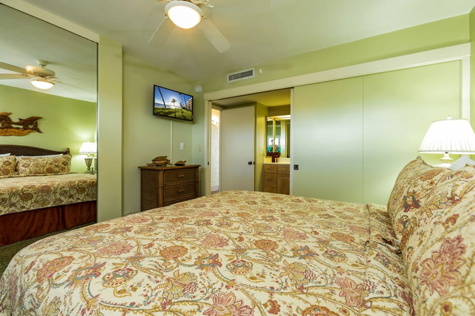Drift off to sleep in this serene tropical bedroom, where soft island-themed linens and warm lighting create your personal paradise. Air-conditioned comfort awaits after your day of adventures.