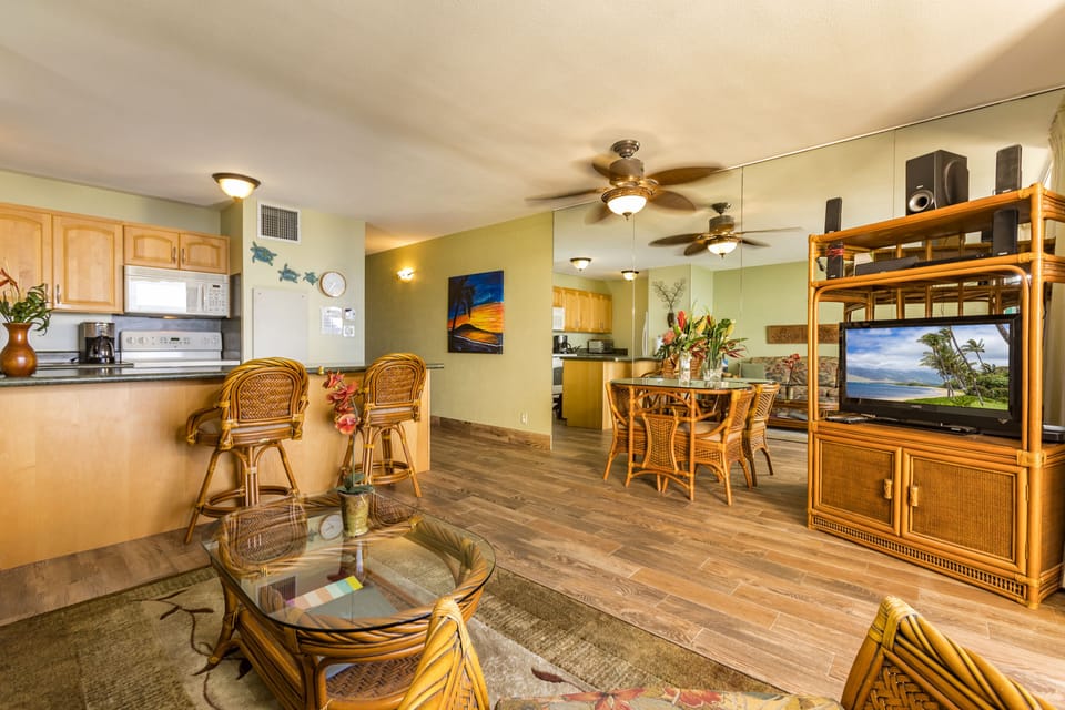 Your island retreat features a bright open layout with tropical furnishings, a fully-equipped kitchen, and ceiling fans to keep you cool and comfortable.