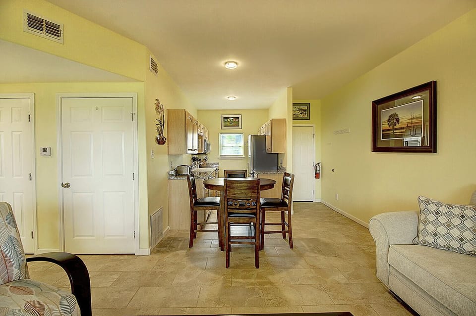 Relax in your open-concept living space where the kitchen flows seamlessly into your dining and lounge area, perfect for memorable meals together.