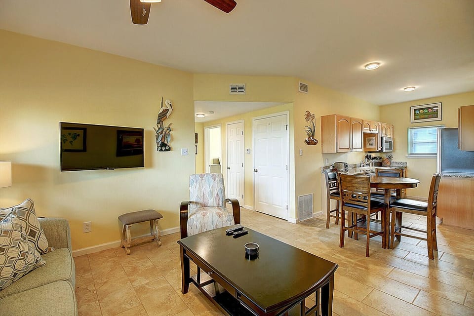 Unwind in your open-concept living space where kitchen, dining, and lounge flow together seamlessly for easy vacation living.