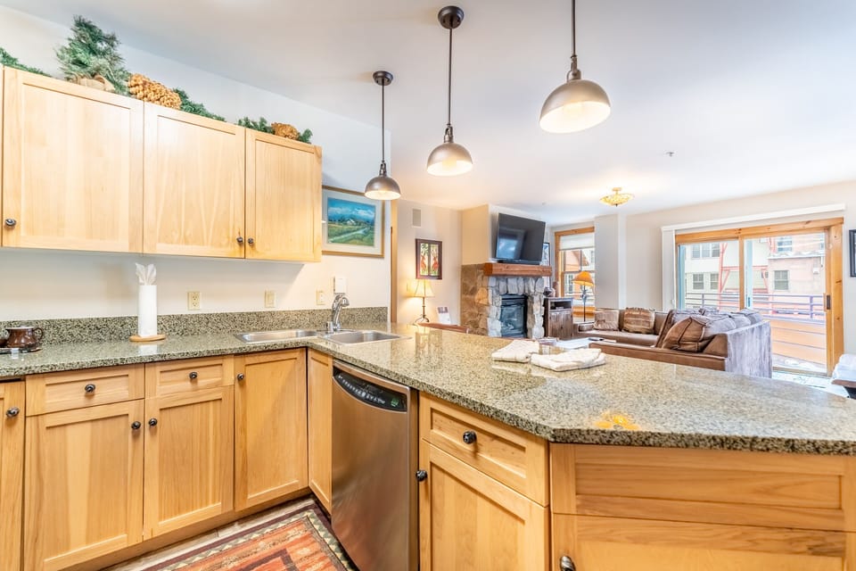 Your fully equipped kitchen flows seamlessly into the cozy living space, perfect for preparing meals while staying connected with loved ones.