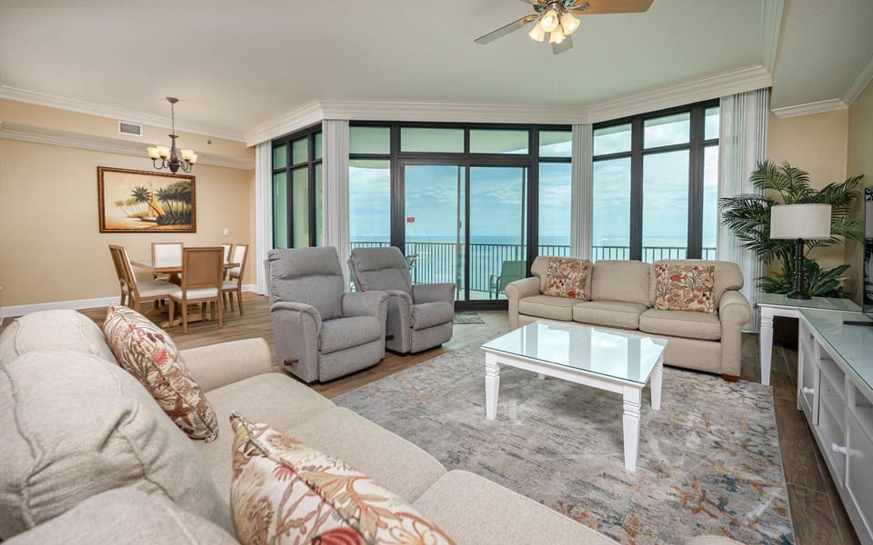 Relax on the cozy sofa with a queen sleeper in this inviting family room with breathtaking beachfront views