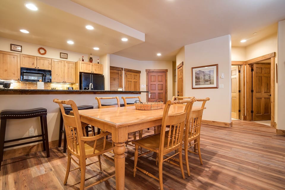 Gather around your spacious dining table for memorable meals, with a fully equipped kitchen just steps away for easy entertaining.