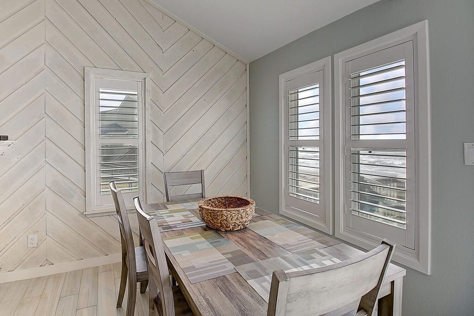 Your dining nook features stunning herringbone wood walls and a reclaimed wood table perfect for memorable meals together.