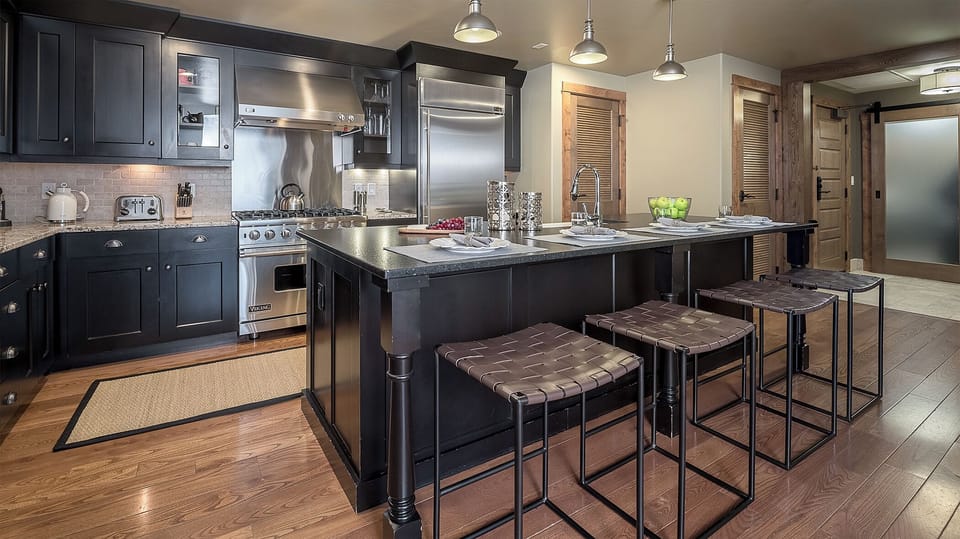 Your gourmet kitchen awaits with professional-grade appliances, granite countertops, and a spacious island perfect for cooking memorable meals together.