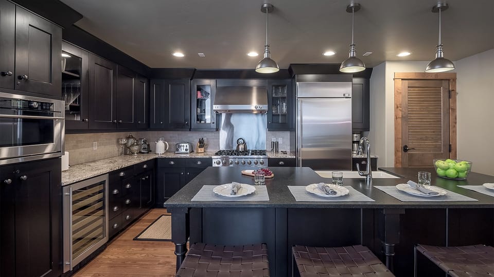 Your gourmet kitchen awaits with sleek granite counters, stainless steel appliances, and a spacious island perfect for cooking memorable meals together.