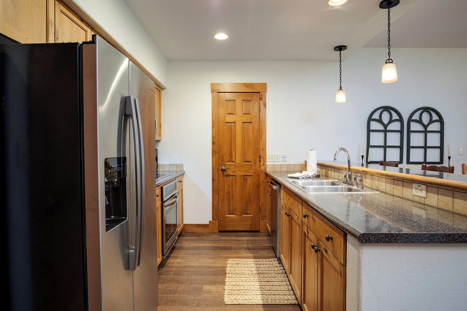 Your fully equipped kitchen features stainless steel appliances and granite counters, perfect for preparing memorable meals during your stay.