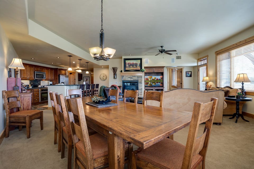 Gather around your spacious dining table while the chef prepares meals in the open kitchen and cozy fireplace warmth fills the room.