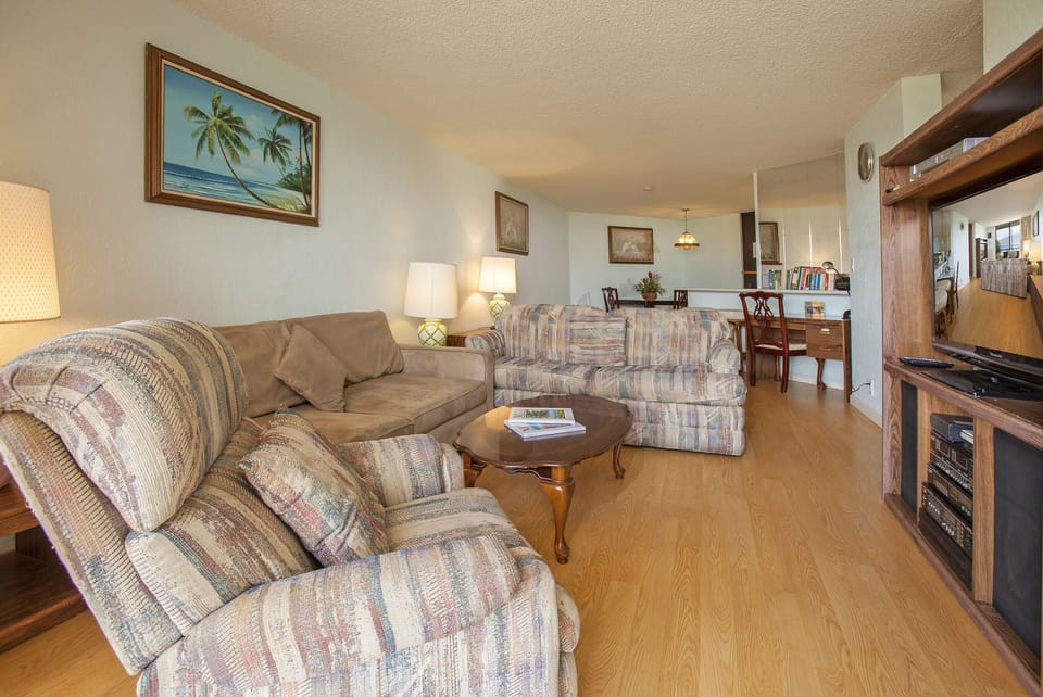 Unwind in your spacious living room with plush seating, warm lighting, and a touch of island charm—perfect for relaxing after exploring or enjoying quality time together.