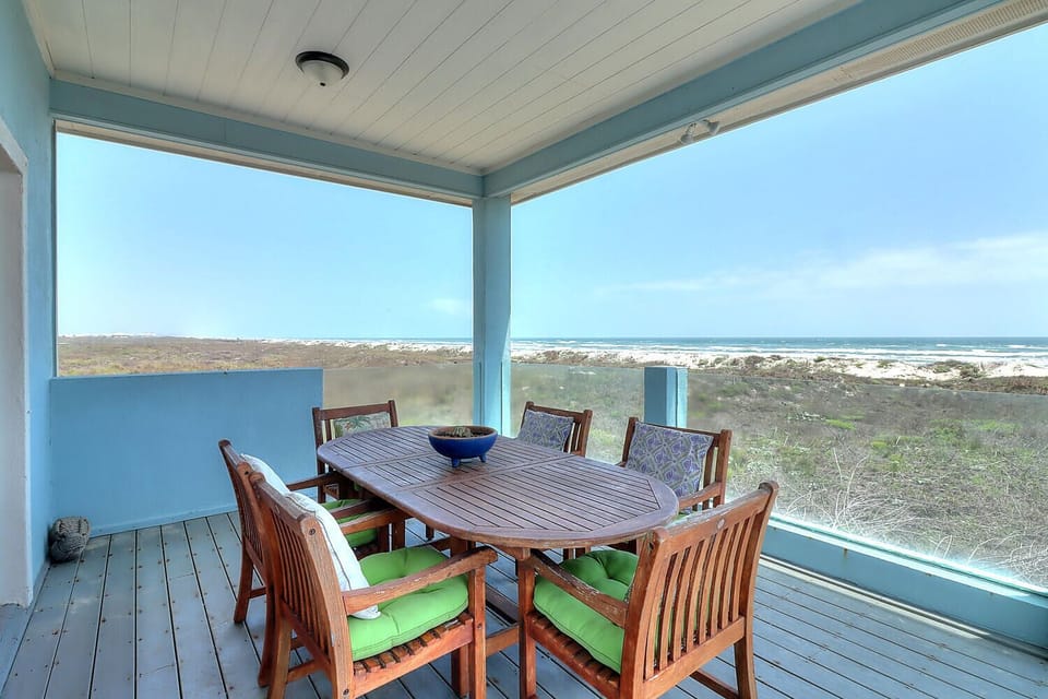 Your private covered terrace offers ocean views while you dine al fresco with comfortable seating for eight.