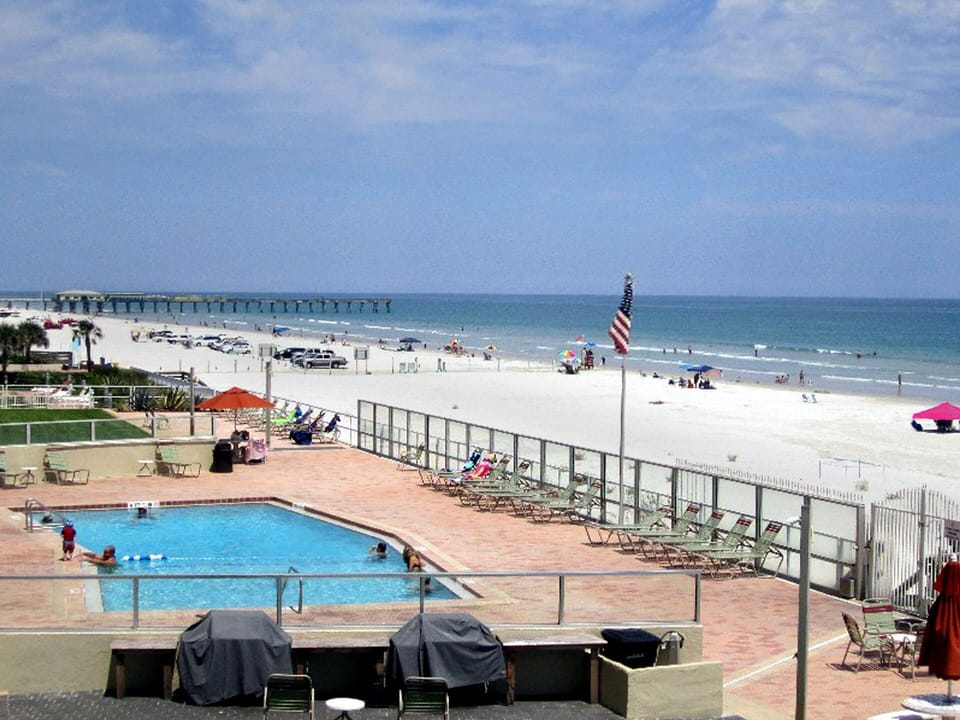 Out the building, across the pool, onto the beach! NO CARS, just peace & quiet!