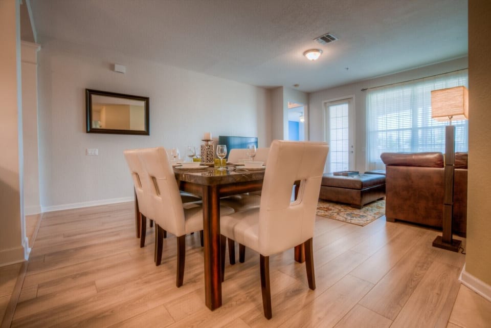 Indulge in comfort and style in our dining area of the condo in Orlando - Welcomes you with cozy and plush 6 persons dinning table - Ensuring that every meal is a delightful experience with your loved ones.