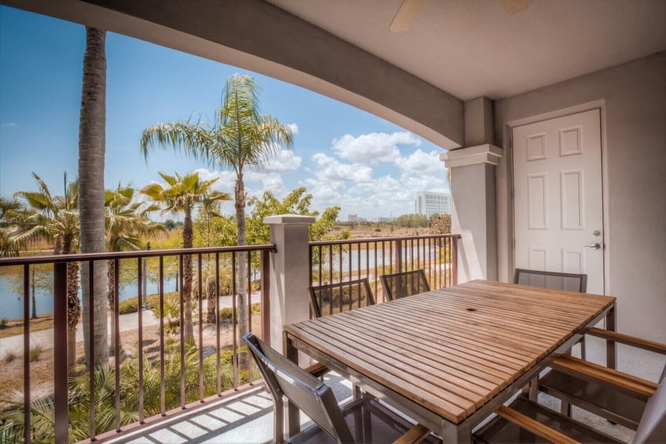 Experience the joy of open-air dining in our inviting private balcony of the condo in Orlando - Every your meals ensures a memorable celebration amidst the fresh outdoor breeze. - Enjoy beautiful lake views while relaxing in our refreshing balcony