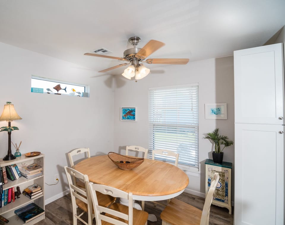 Gather around this welcoming dining table where you'll share memorable meals with loved ones in bright, coastal-inspired comfort.