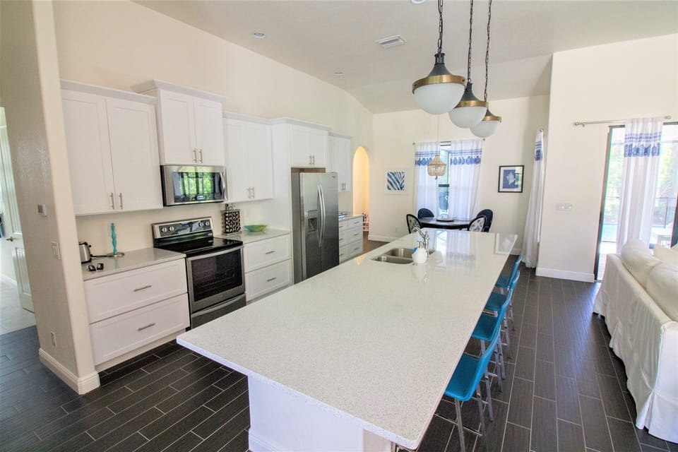 14 foot island in kitchen, great for entertaining.  Well stocked kitchen