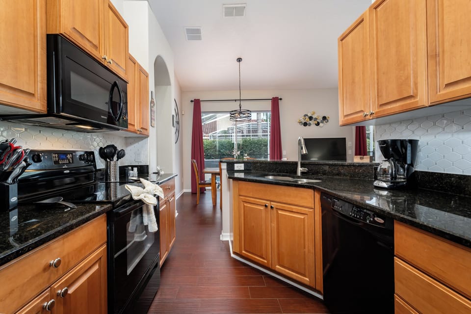 Kitchen view showing cabinets.