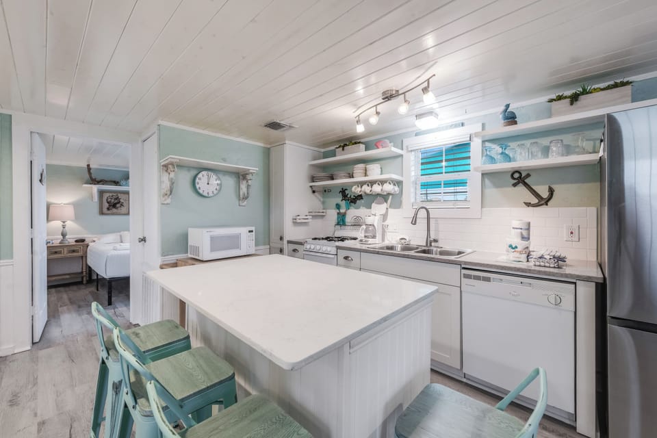 Your bright coastal kitchen features sea-glass touches and everything you need for memorable meals together.
