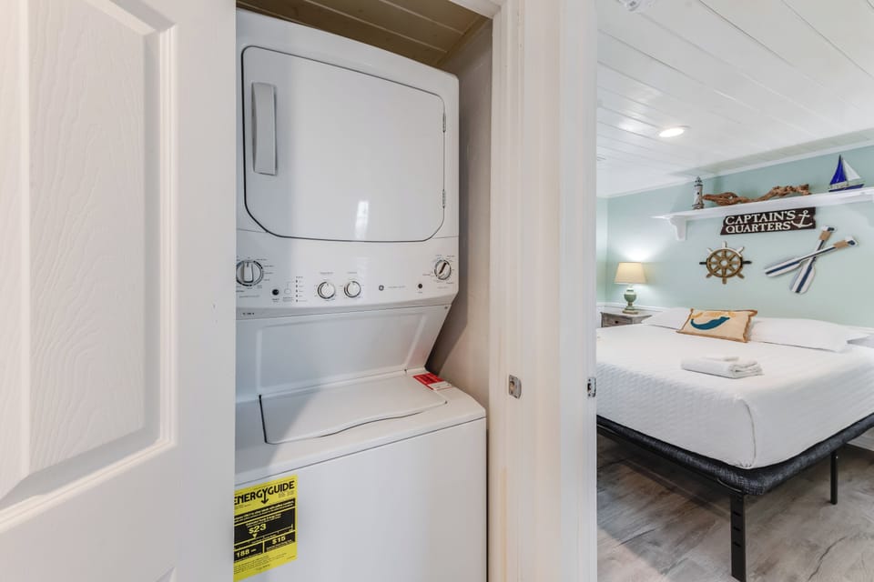 Your in-unit washer and dryer keep you comfortable throughout your stay, while nautical-themed decor creates a coastal retreat.