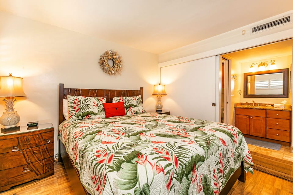 Slip into your tropical oasis, where a plush bed awaits with vibrant island-inspired linens and warm bedside lighting to welcome you home after each adventure.