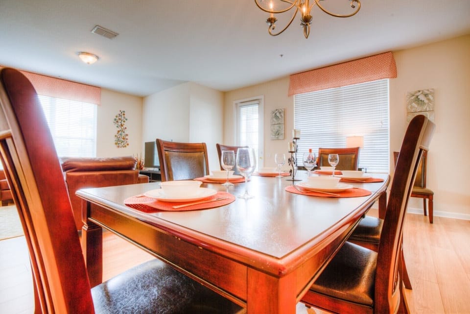 The dining area radiates charm, inviting shared moments and delightful meals in a setting that effortlessly combines style and comfort.