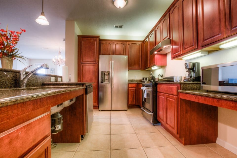 Prepare your favorite meals in the fully equipped kitchen, complete with modern appliances, and enjoy them at the countertop table with comfortable high chairs.
