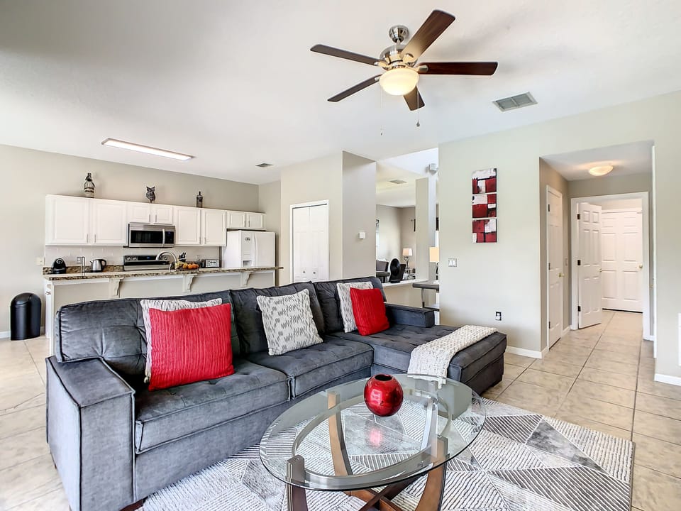 Living room with kitchen in background.