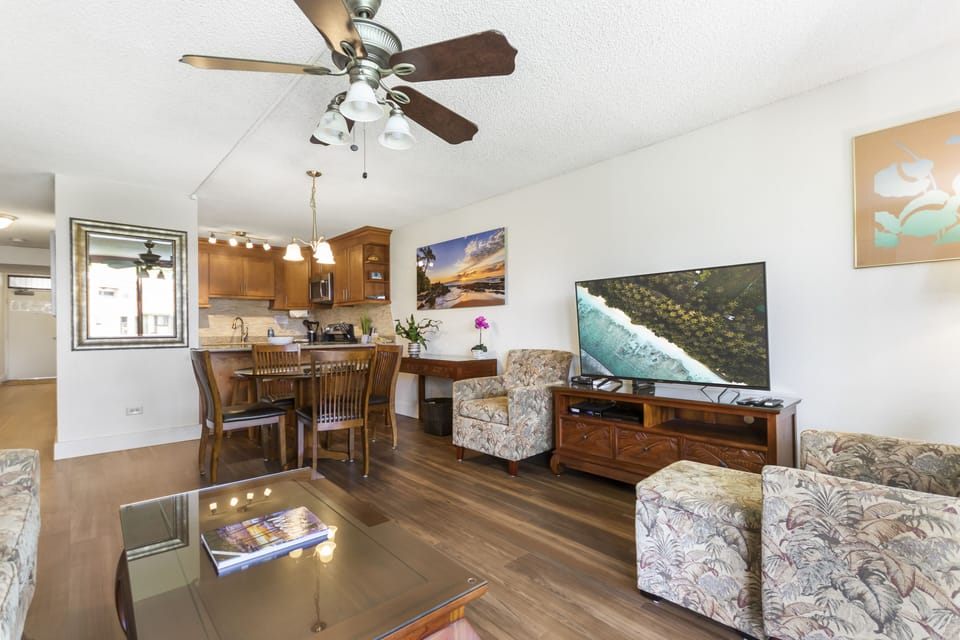Relax in your spacious open-concept living area with comfortable seating, a large smart TV, and a fully equipped kitchen—perfect for unwinding after island adventures or preparing your favorite meals.