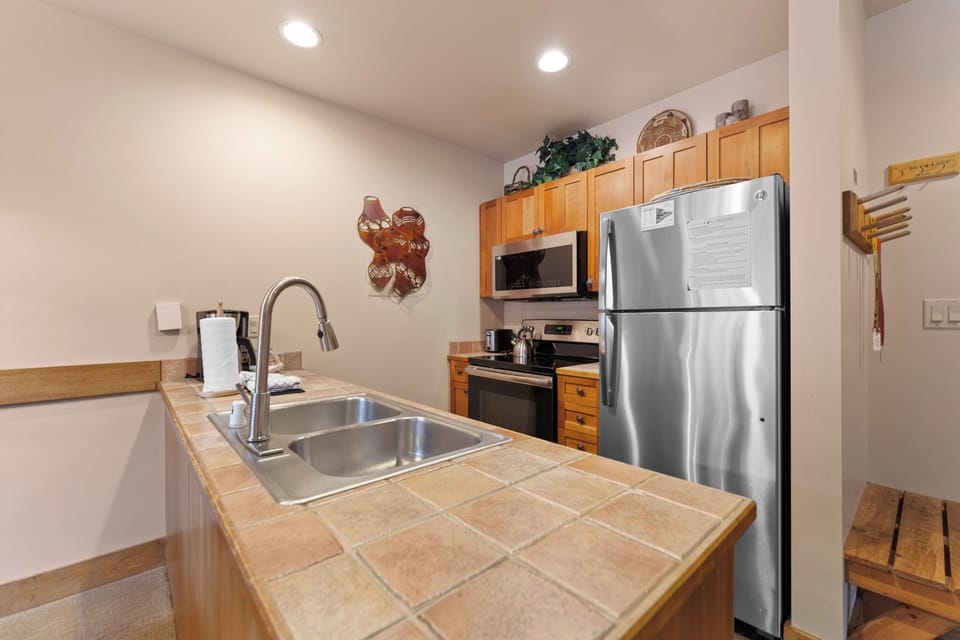 Your fully equipped kitchen features stainless steel appliances, ample counter space, and everything needed to prepare delicious meals during your stay.