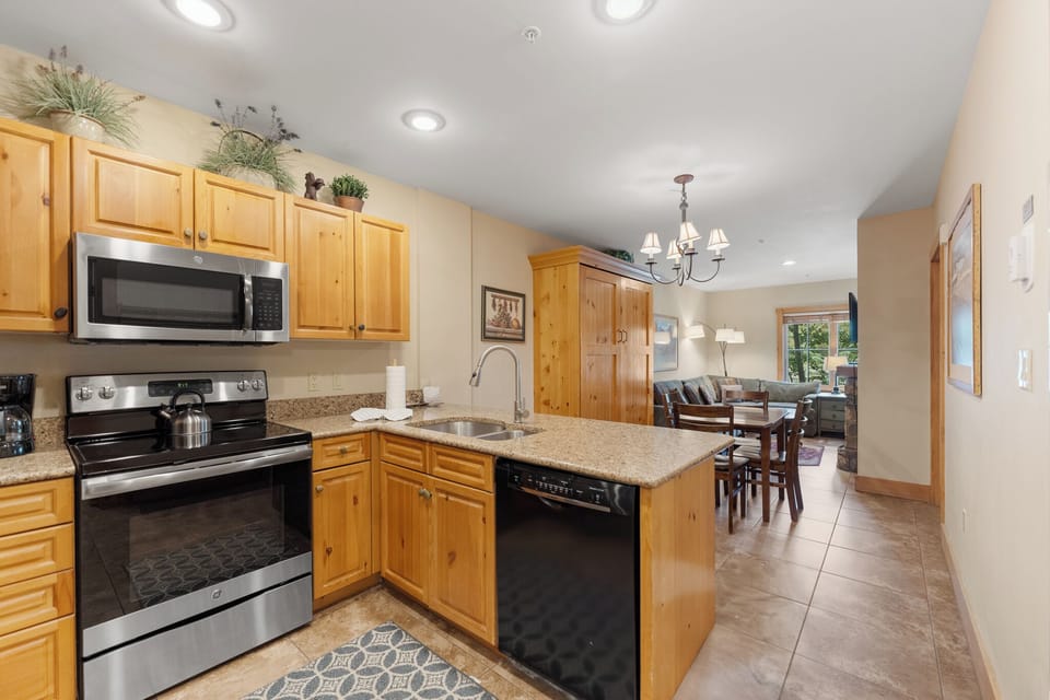 Step into your fully equipped kitchen with granite counters and modern appliances, perfect for preparing meals during your stay.
