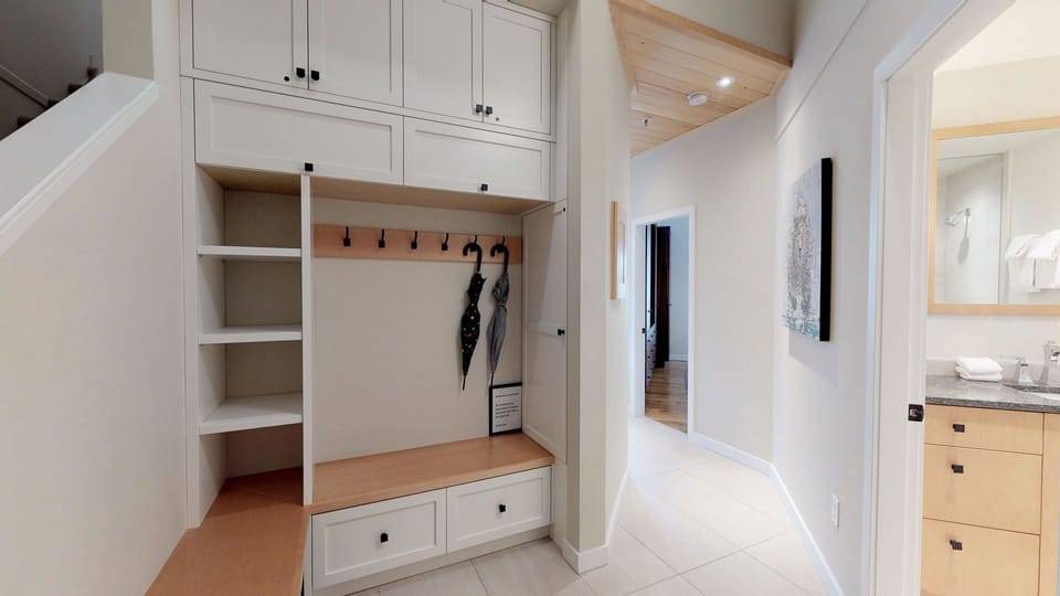 The large entryway doubles as a functional mudroom with storage for gear.